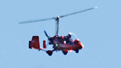 gyrocopter- rear propeller is run by engine; top propeller then "lifts" the copter